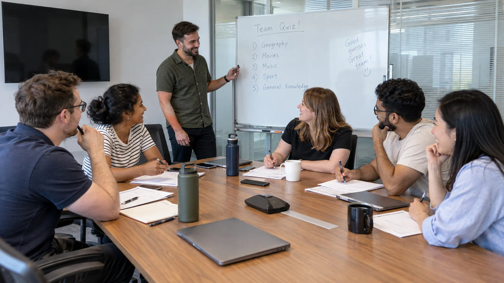 Colleagues sharing answers at a relaxed workplace team social