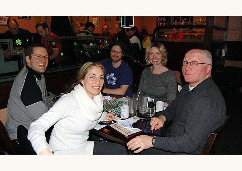 Original article photograph of a quiz team seated around a pub table