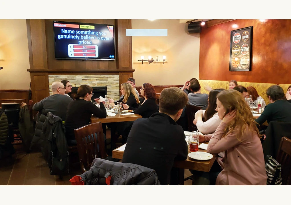 Original article photograph of a quiz event with its presentation screen