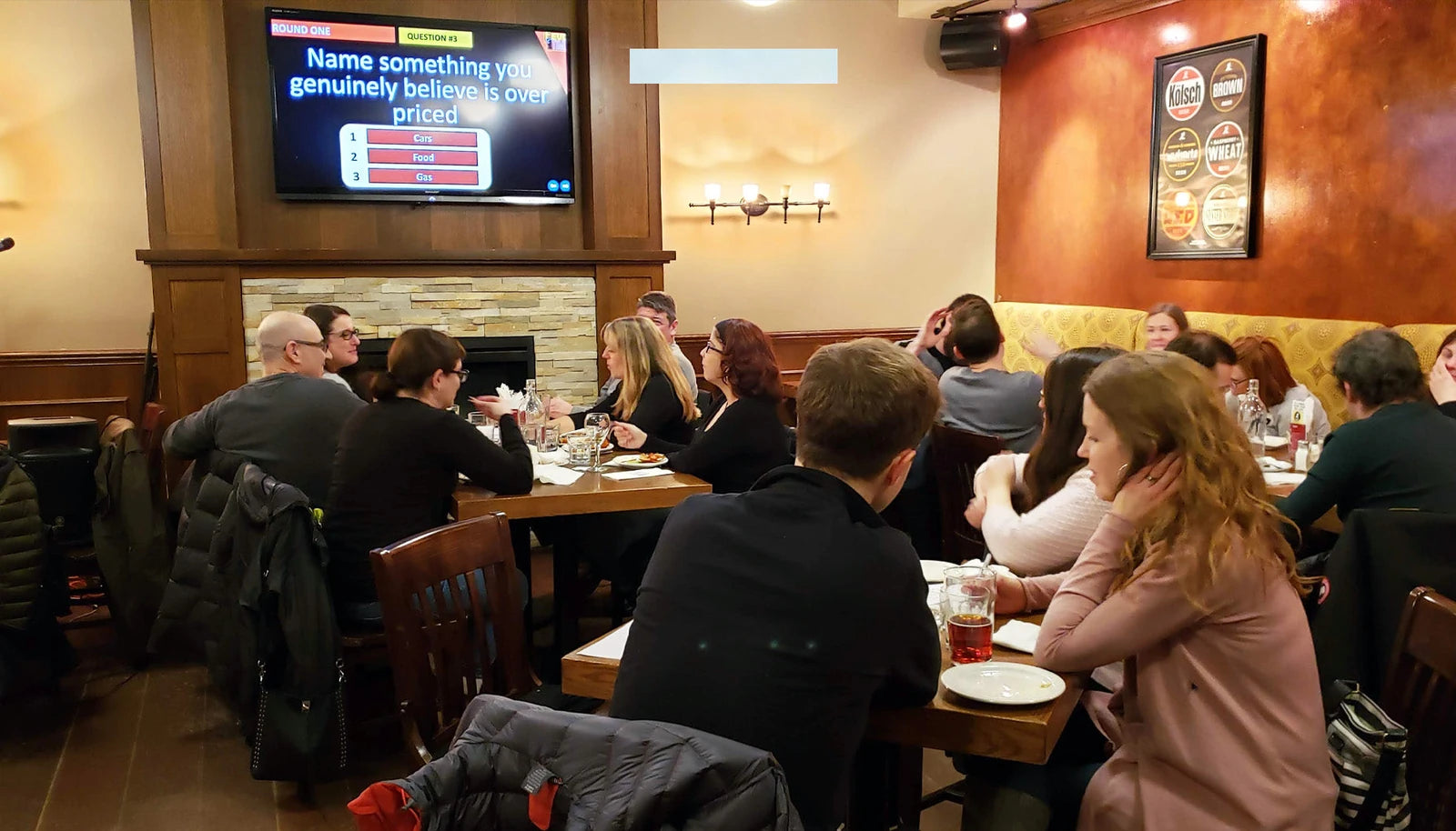 Original article photograph of a quiz event with its presentation screen