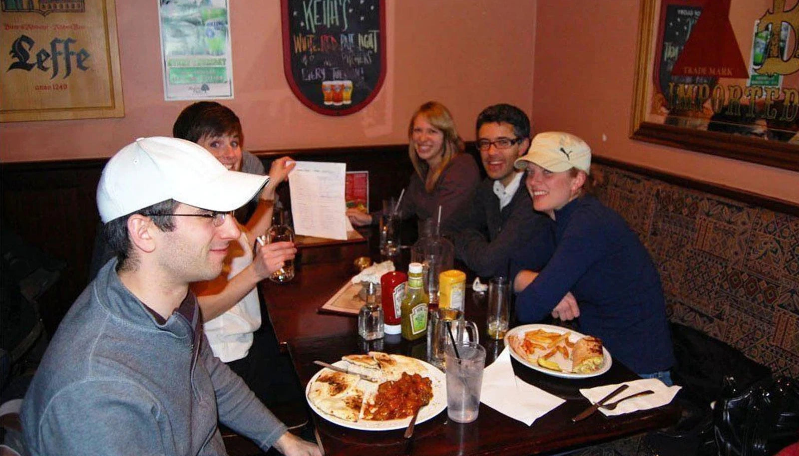 Original article photograph of friends taking part in a pub quiz