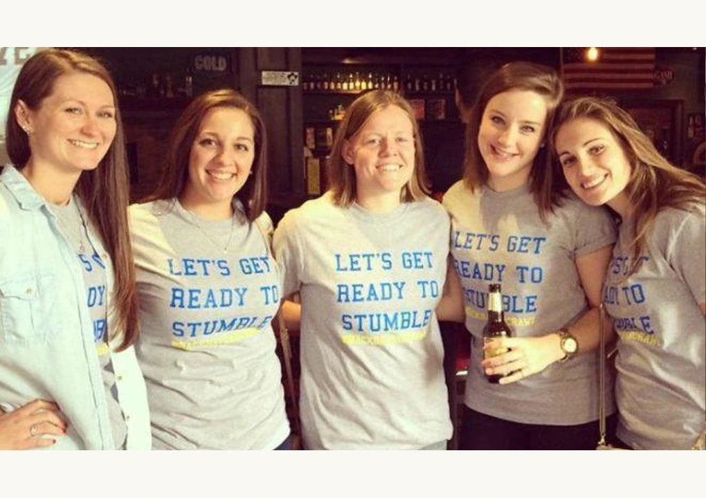 Original article photograph of a team wearing matching quiz-night shirts