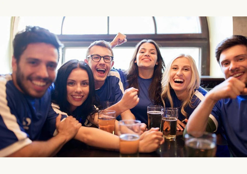 Original article photograph of friends gathered around a pub table