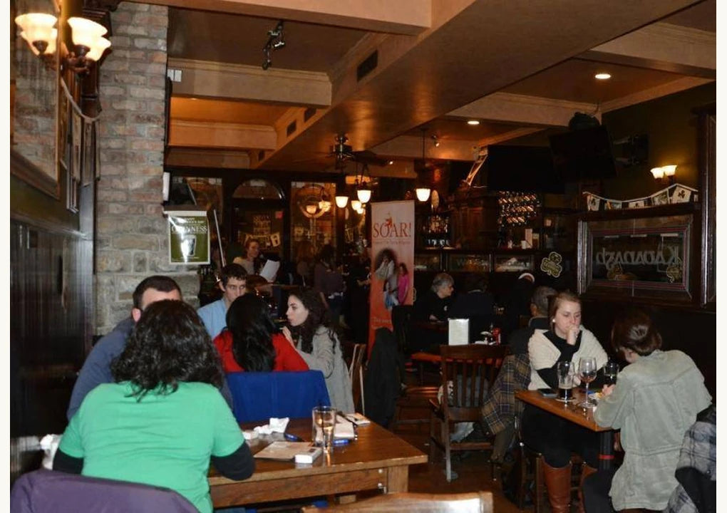 Original Ireland's Four Courts case-study photograph of quiz players inside the pub