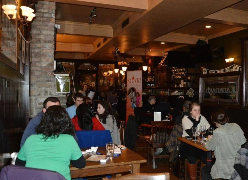 Original Ireland's Four Courts case-study photograph of quiz players inside the pub