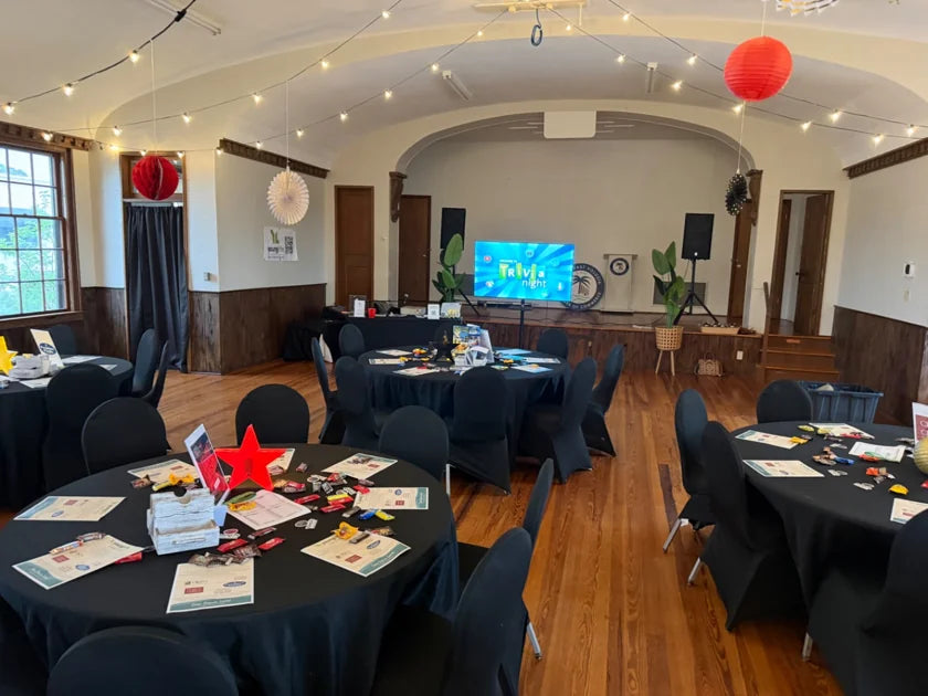 Tables set for a fundraising quiz, photographed by Carina P.